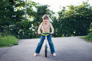 Portrait of a boy on a balance bike