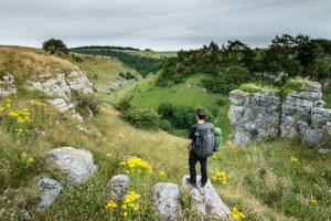 Landscape photographer James Abbott hiking in the Peak District